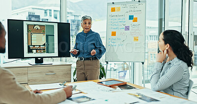 Buy stock photo Mature woman, discussion or meeting with screen for presentation, interior design or floor plan at office. Female person, architect or designer talking with team for renovation or construction layout