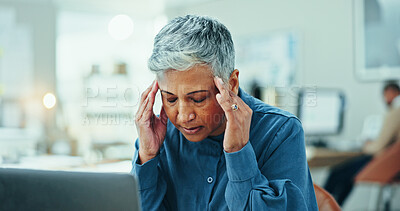 Buy stock photo Mature, frustrated woman or headache with laptop for deadline, overworked or strain at office. Senior, female person or migraine with stress or pain for anxiety, vertigo or dizziness at workplace