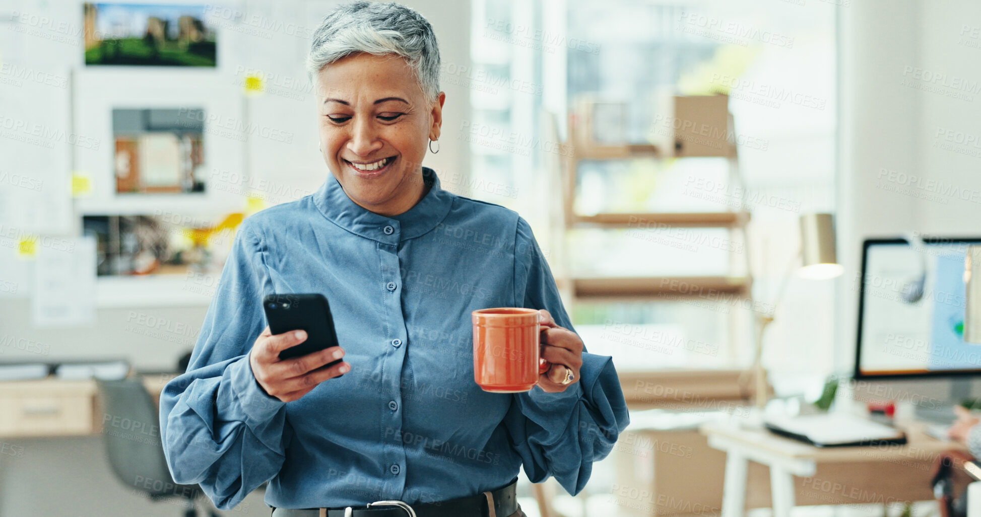 Buy stock photo Woman, phone and happy at startup with coffee, notification or deal for project in studio. Mature person, art dealer and smartphone for email, contact and mobile app for networking at creative agency