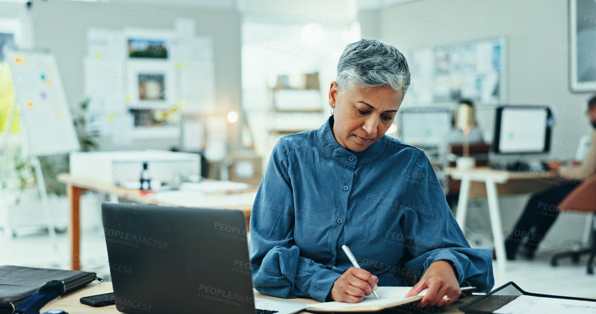 Buy stock photo Office, laptop and mature woman with notes, business plan and online website project for graphic design. Schedule, research and businesswoman writing creative ideas in notebook at digital agency.