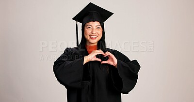 Buy stock photo Heart hands, graduation and smile with portrait of asian woman in studio for success, college degree or award. Achievement, education and university student with person on white background for mockup