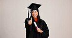 Thumbs up, graduation and diploma with portrait of asian woman in studio for success, college degree or award. Achievement, education and university student with person on white background for mockup