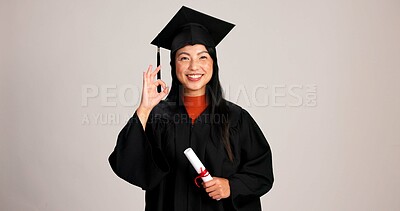 Buy stock photo Ok, graduation and diploma with portrait of asian woman in studio for success, college degree or award. Achievement, education and university student with person on white background for mockup space