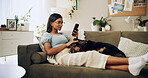 Calm, dog and phone with woman on sofa for bonding, social media post and pet adoption. Relax, scroll and animal rescue with person in living room at home for foster care, search and online app