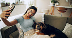 Smile, dog and selfie with woman on sofa for bonding, social media post or pet adoption. Photography, relax and animal rescue with person in living room at home for foster care, picture or online app