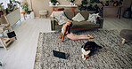 Laptop, girl and yoga with dog in home for stretching, online class and fitness lesson in living room. Yogi, person and cobra pose with virtual exercise video for instructions and holistic wellness