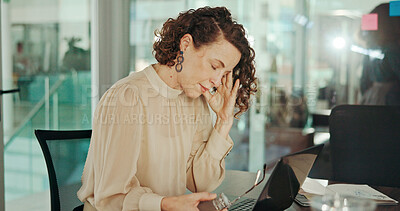 Buy stock photo Frustrated woman, laptop and headache with stress for debt, bankruptcy or financial crisis at office. Tired, female person or employee with migraine on computer for strain, pressure or deadline