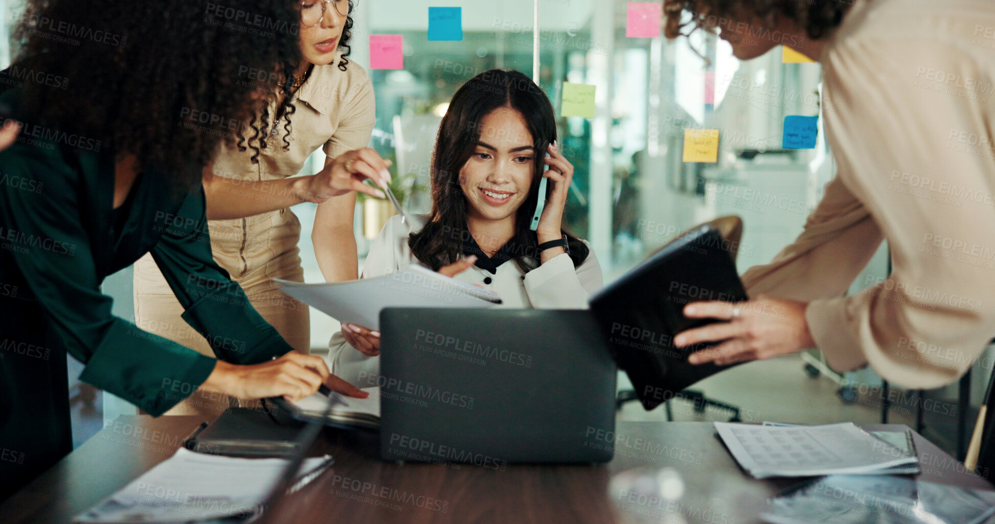 Buy stock photo Phone call, laptop and multitasking with business woman in meeting for deadline, report and paperwork. Pressure, team and collaboration with people in office for proposal, leader and policy review