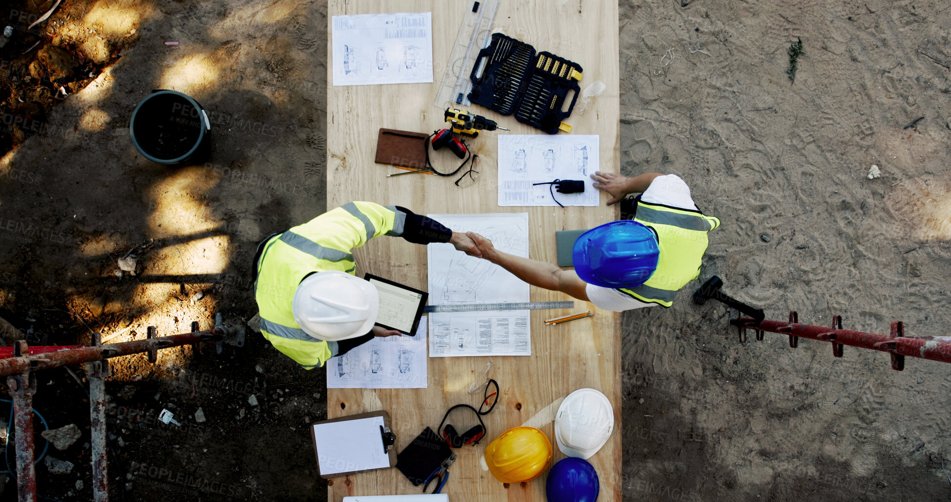 Buy stock photo Blueprint, construction and men at table with handshake, collaboration and inspection agreement from above. Architect, building team and contractor shaking hands with floor plan, partnership and deal