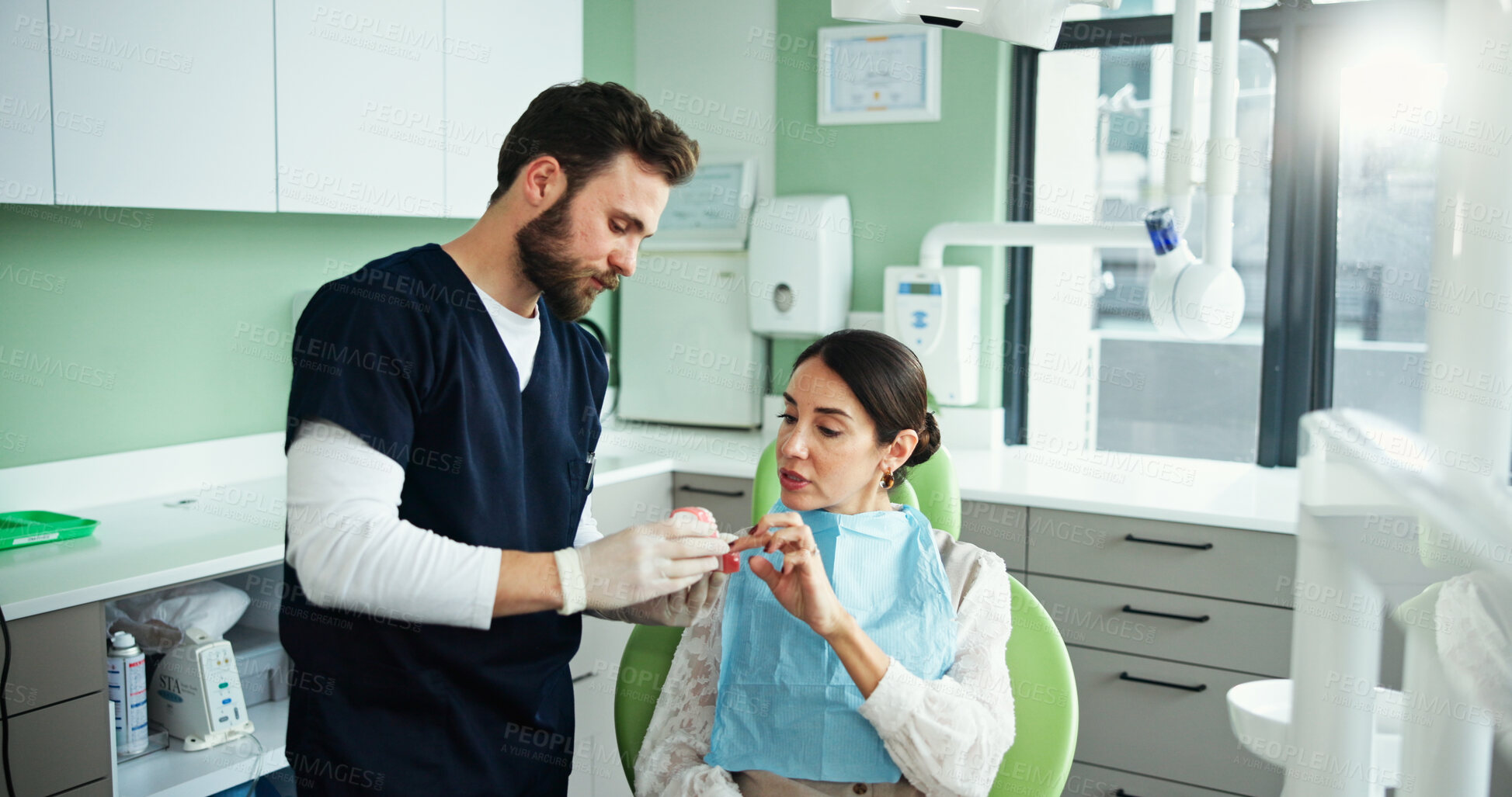 Buy stock photo Dentist, mouth mold and woman in clinic for cleaning, dental hygiene and gum wellness demonstration. Healthcare, dentistry and patient with hygienist for consulting, oral care and medical service