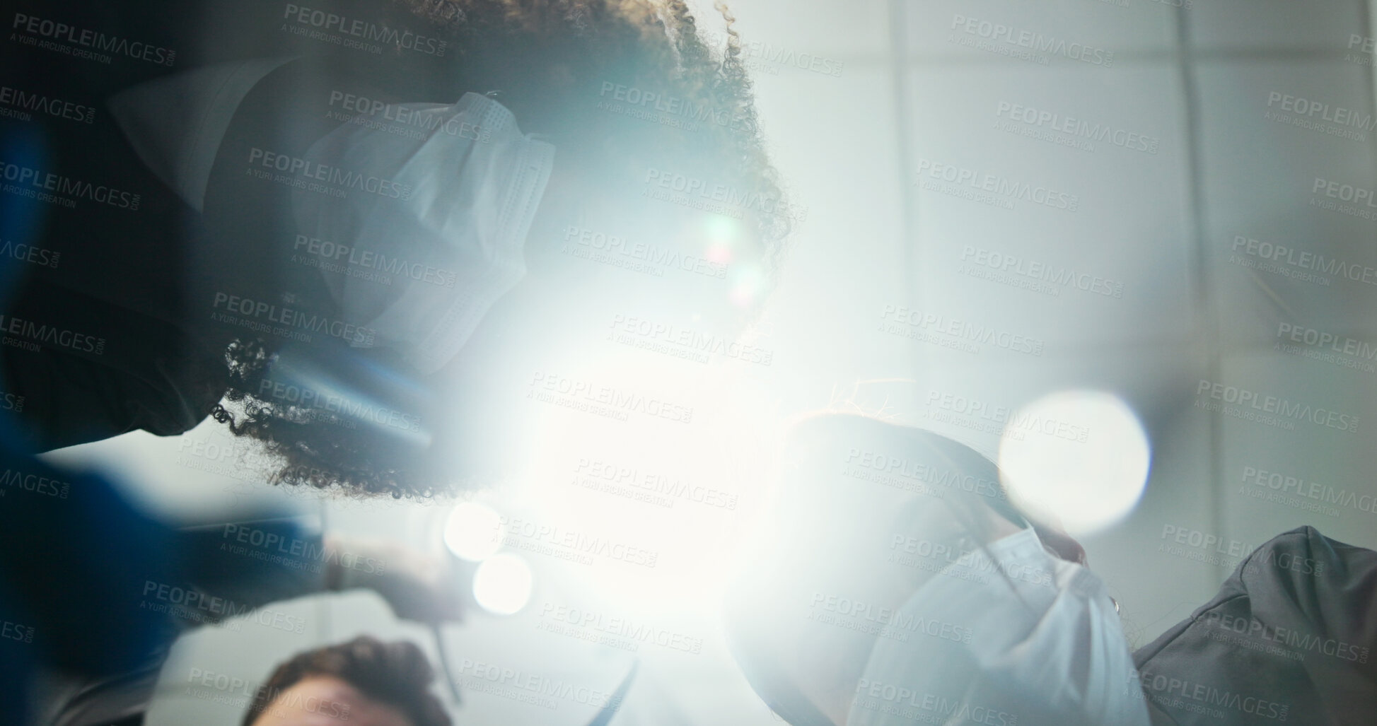 Buy stock photo Dentist, team or light below with dental team for hygiene, cleaning or cavity removal at hospital. Lens flare, low angle and medical orthodontist with patient checkup for oral, mouth or gum care exam