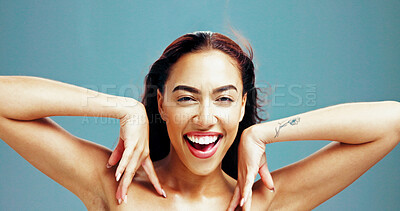 Buy stock photo Excited, skincare and portrait of woman with beauty, glow and shine on blue studio background. Face, happy and confident model in makeup cosmetics for dermatology, aesthetic or spa facial treatment