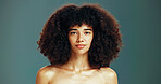 Portrait, confident and woman with afro hair care, studio and treatment for wellness and health. Face, growth or proud girl model with beauty, volume and natural texture on green background in Brazil