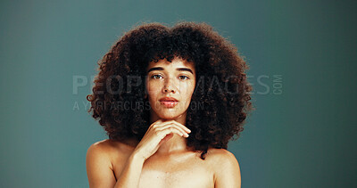 Buy stock photo Confident, haircare and woman with afro, studio and healthy hair with treatment, portrait or texture. Space, green background and serious for growth of hairstyle, proud or person with hairdo in salon