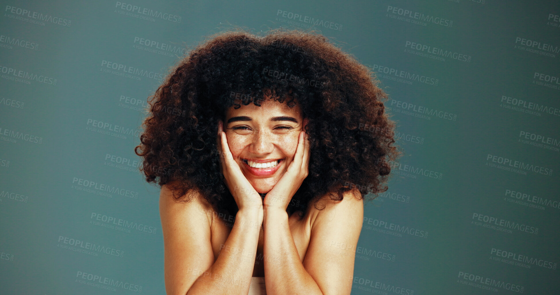 Buy stock photo Portrait, beauty and excited woman with afro hair care, studio and treatment for wellness and health. Face, growth and happy model with smile, volume and natural texture on green background in Brazil