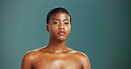 Portrait, skincare and confident black woman with beauty, glow and shine on studio background. Face, serious and African model in makeup cosmetics for dermatology, aesthetic and spa facial treatment