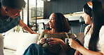 Bonding, laughing and friends with coffee, home and listening to gossip, couch and drinks in living room. Happy, conversation and relax in lounge, tea and together in weekend, talk or people in house