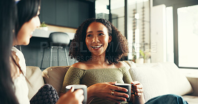 Buy stock photo Bonding, women and friends with coffee, home and listening to gossip, couch and drinks in living room. Happy, conversation and relax in lounge, tea and together in weekend, talking or people in house