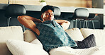 Man, tired and stretching on sofa for relax, comfort and resting on weekend in home. Person, fatigue and posture in living room for spine adjustment, muscle tension and stress free on lounge couch