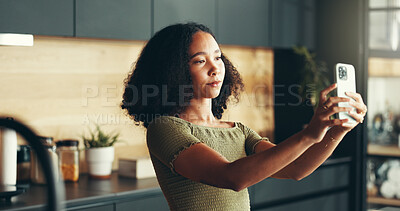 Buy stock photo Woman, sad and selfie in home for social media, blog update and anxiety for follower loss. Girl, networking and upset in kitchen with photography, connection error and recording video for vlog post
