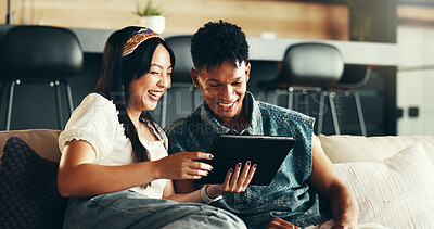 Buy stock photo Happy couple, tablet and funny post in living room for social media, online and watching video. Female person, man and laughing on technology in home as bonding, relax or together on sofa as cheerful