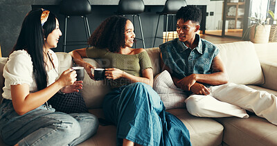 Buy stock photo Bonding, smile and friends with coffee, home and listening to gossip, couch and drinks in living room. Happy, conversation and relax in lounge, tea and together in weekend, talking or people in house