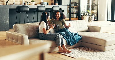 Buy stock photo Bonding, chat and friends with coffee, home and listening to gossip, couch and drinks in living room. Happy, conversation and relax in lounge, tea and together in weekend, talking and people in house