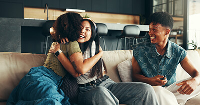 Buy stock photo Women, excited and hug in living room for reunion, friends and happiness in embrace as thank you. Female people, man and smile in apartment or home as welcome, relax and cheerful on sofa as surprise
