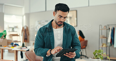 Buy stock photo Business, man and fashion designer on tablet at office for online orders, delivery and supply chain. Male person, entrepreneur and website for workshop management with textiles, clothes or logistics