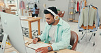 Office, man and fashion designer on computer with notebook for online orders notes, information and schedule. Male person, headphones and small business with diary or journal for creative project