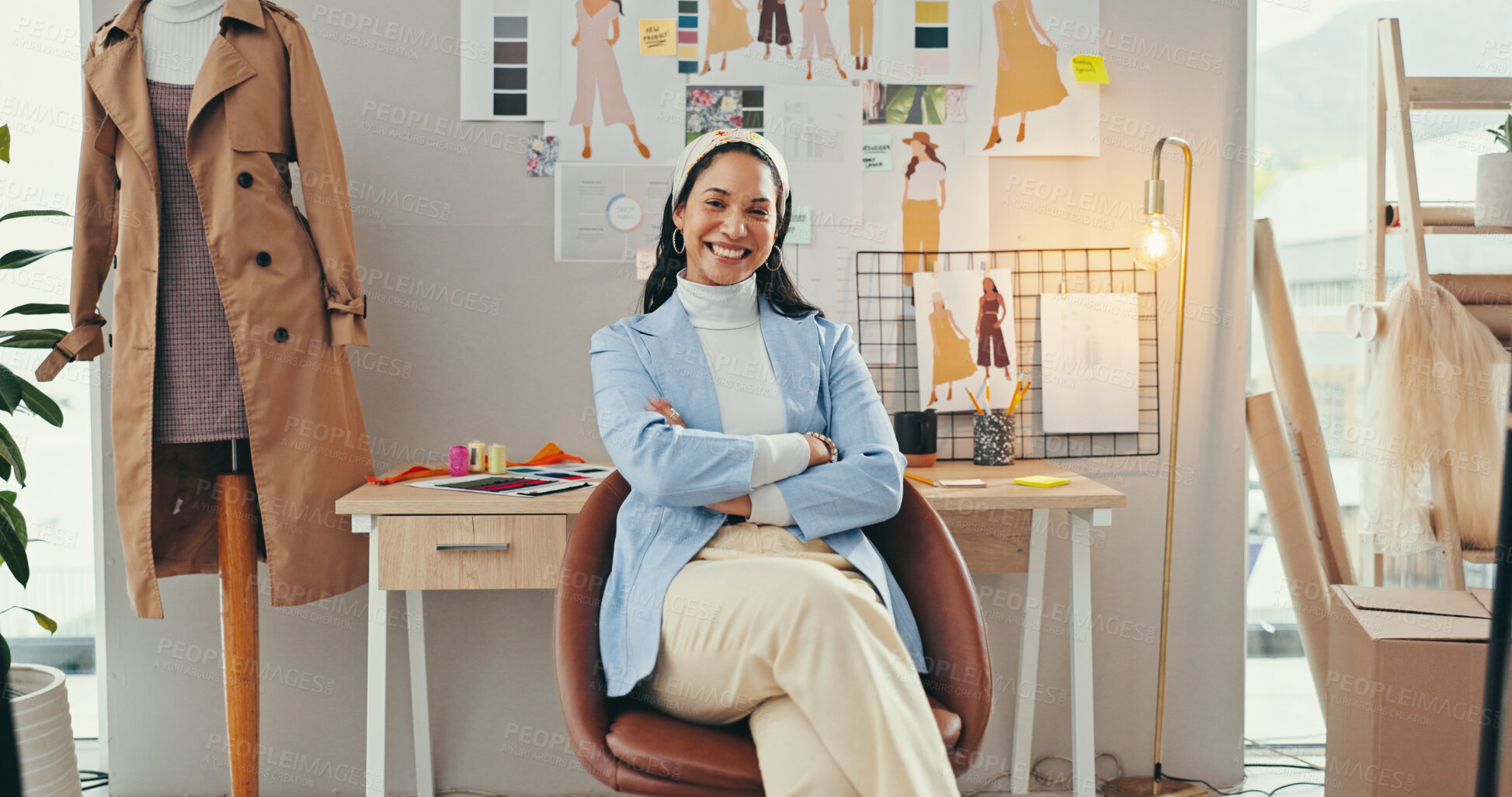 Buy stock photo Arms crossed, confident and portrait of fashion designer woman in textile workshop for production. Clothes, creative and wall with happy style director at desk in office for manufacturing process