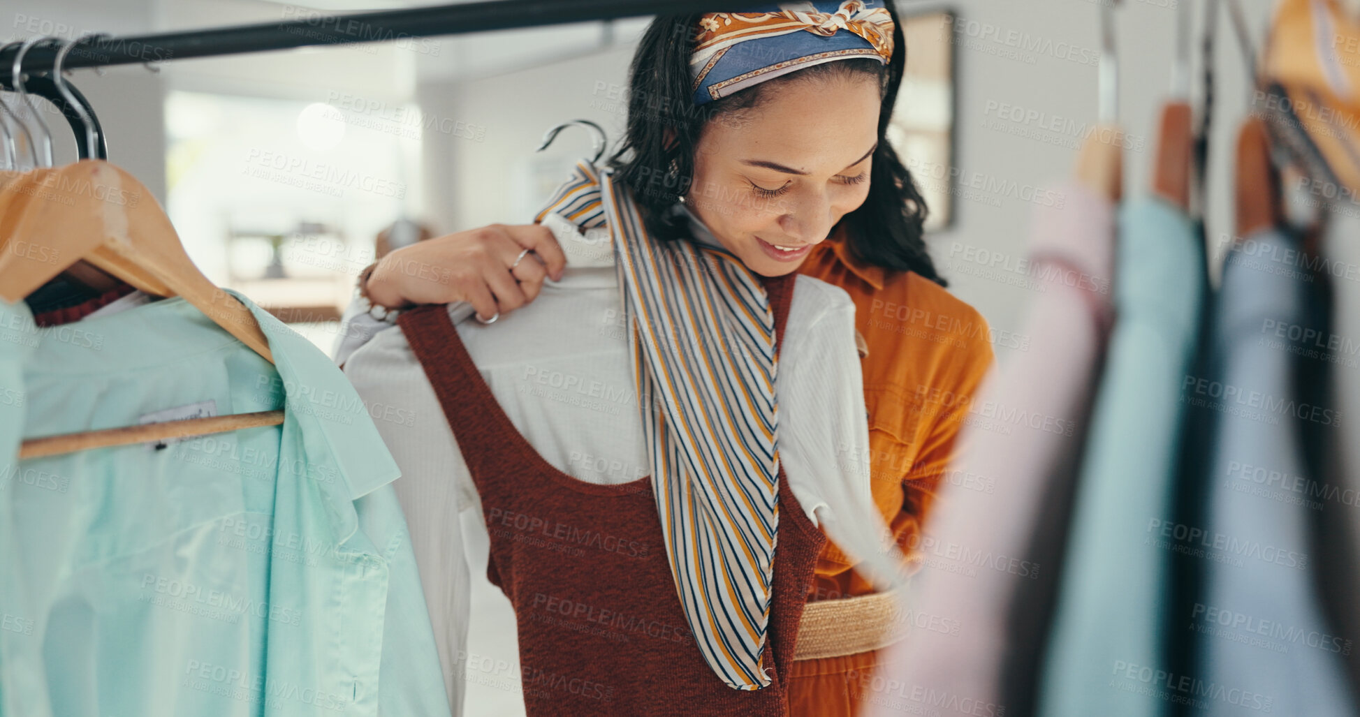 Buy stock photo Small business, woman and happy with outfit on clothes rack at workshop as fashion designer. Female person, entrepreneur and smile or confident as stylist at office for supply and fabric brand