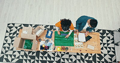 Buy stock photo Small business, people and packaging clothes for shipping with online order, product distribution or teamwork. Fashion store, top view or employee wrap parcel for courier delivery or export inventory