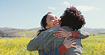 Friends, women and happy with hugging in field for travel adventure, reunion and bonding at rapeseed farm. Weekend trip, people and embrace in countryside for surprise connection and excited together