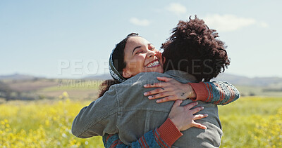 Buy stock photo Friends, women and happy with hugging in field for travel adventure, reunion and bonding at rapeseed farm. Weekend trip, people and embrace in countryside for surprise connection and excited together