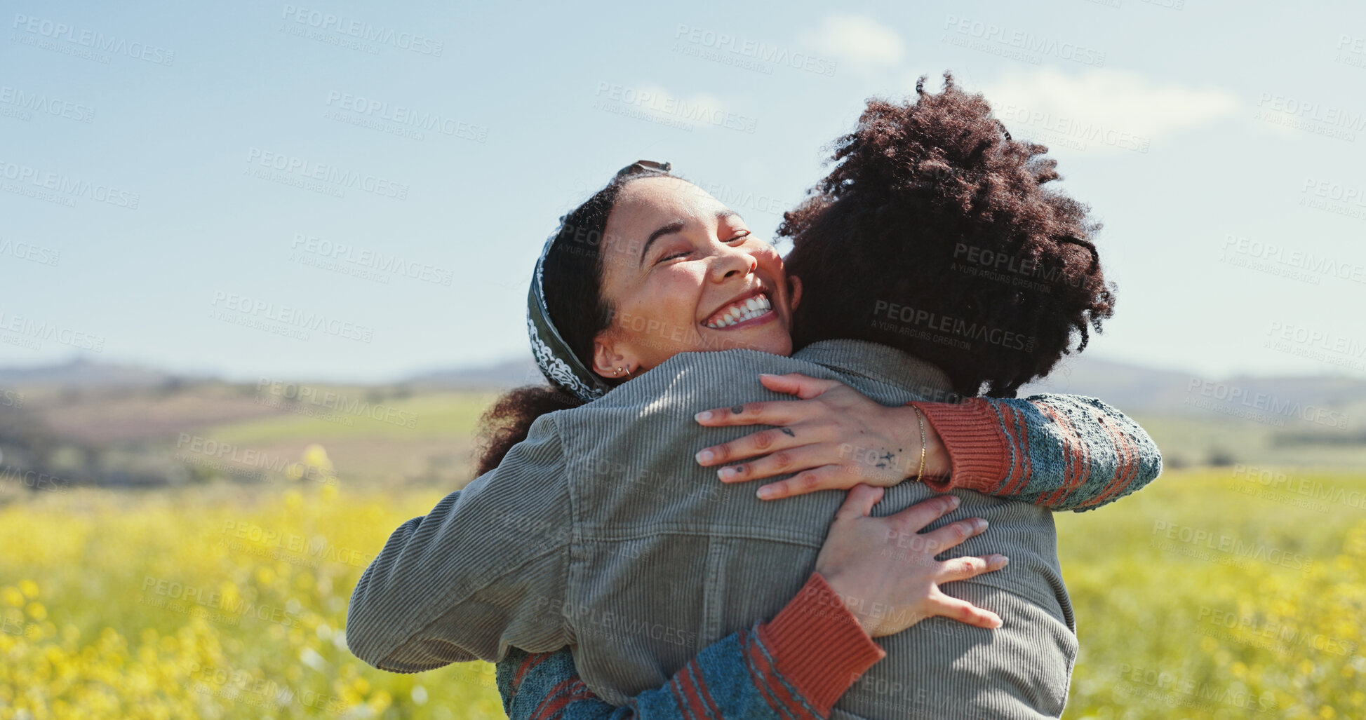 Buy stock photo Friends, women and happy with hugging in field for travel adventure, reunion and bonding at rapeseed farm. Weekend trip, people and embrace in countryside for surprise connection and excited together