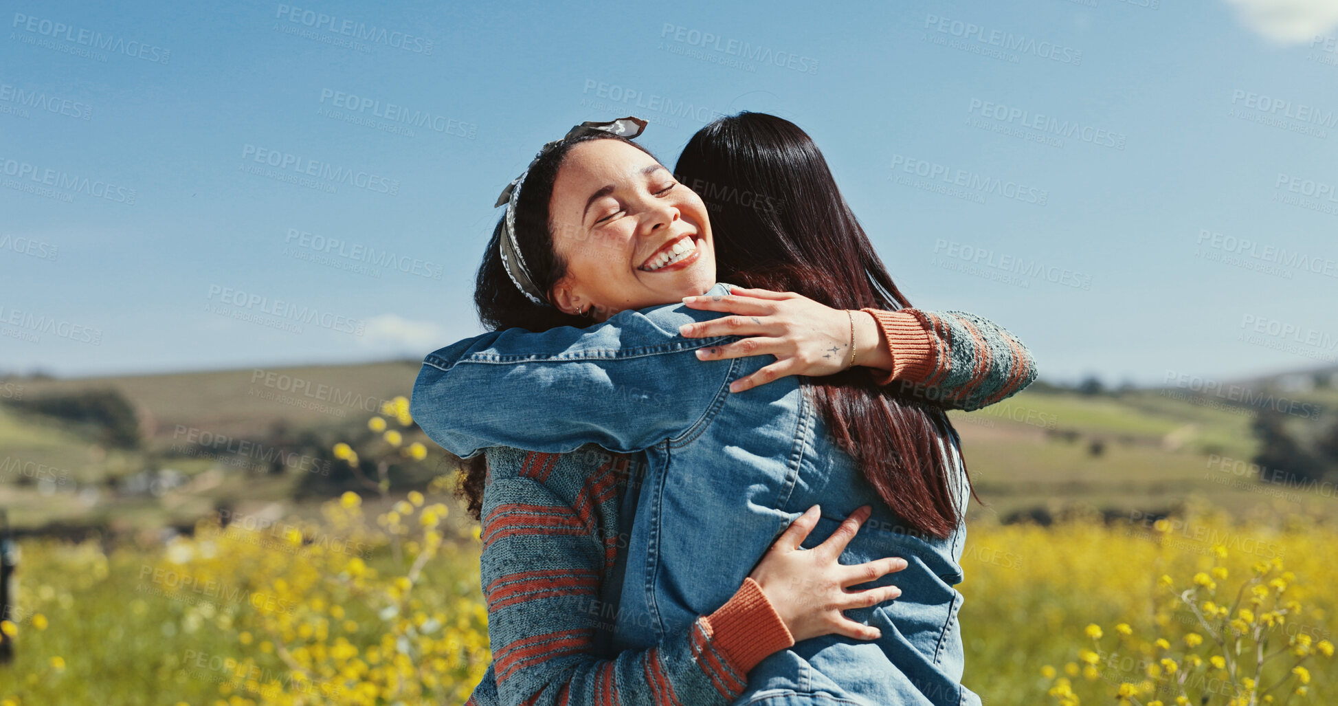 Buy stock photo Friends, women and happy with hugging in countryside for travel adventure, reunion and bonding at rapeseed farm. Weekend trip, people and embrace in field for surprise connection and excited together