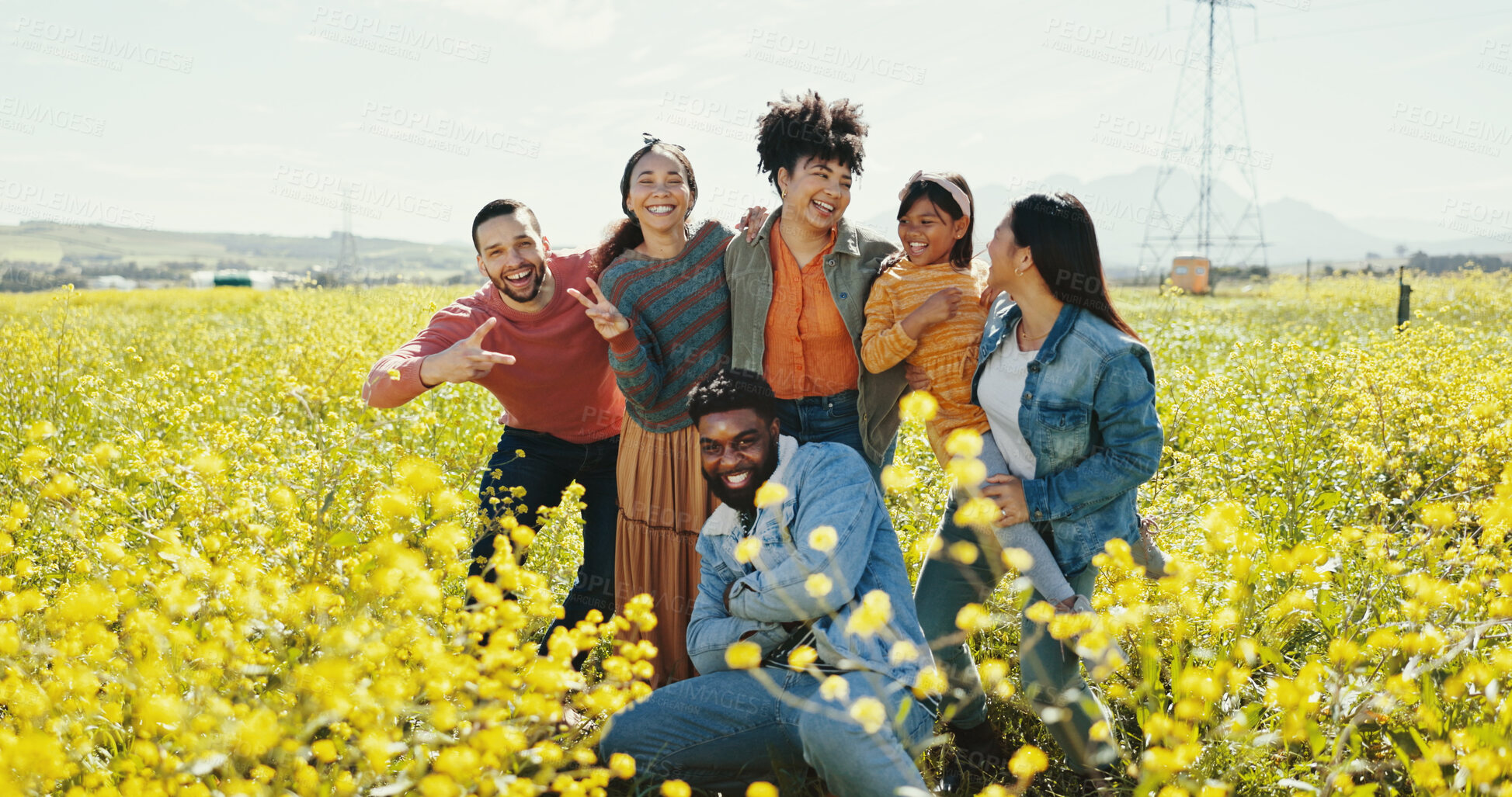 Buy stock photo Portrait of family, friends and child in park together for summer holiday, travel or vacation. Emoji, having fun or smile and group of happy people outdoor in field of yellow flowers for getaway