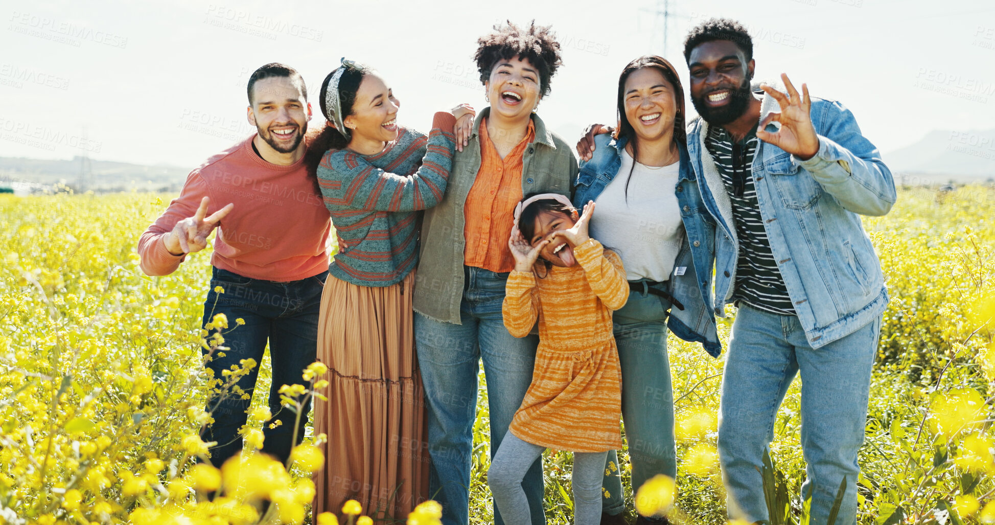 Buy stock photo Family, friends and child laughing in park together for summer holiday, travel or vacation. Funny, love or smile and group of happy people outdoor in field of yellow flowers for getaway or road trip