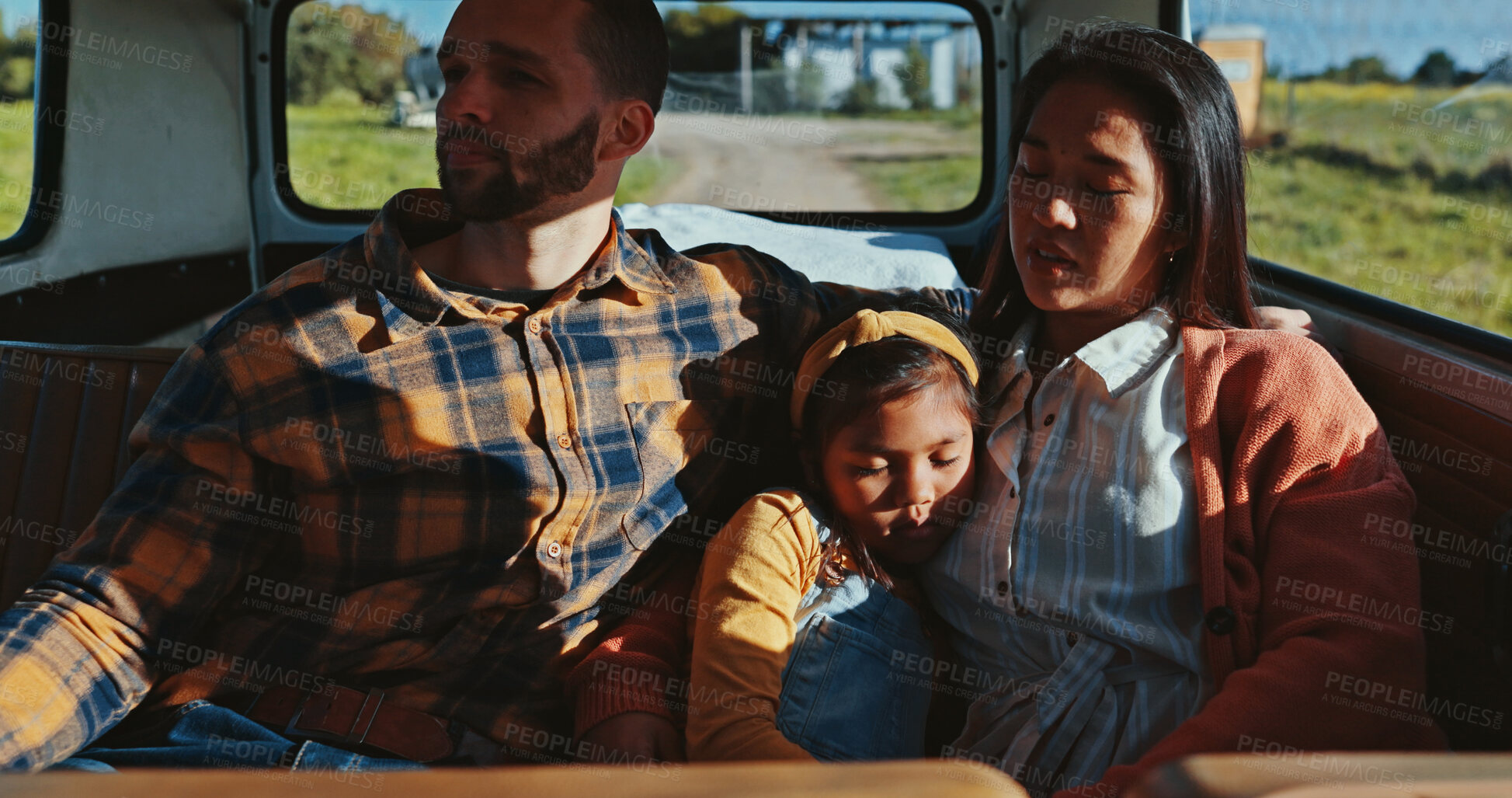 Buy stock photo Sleeping, road trip and van with child, family and break for journey, resting or countryside travel. Relax, kid or tired girl bonding for adventure, holiday or vacation together with car, mom or dad