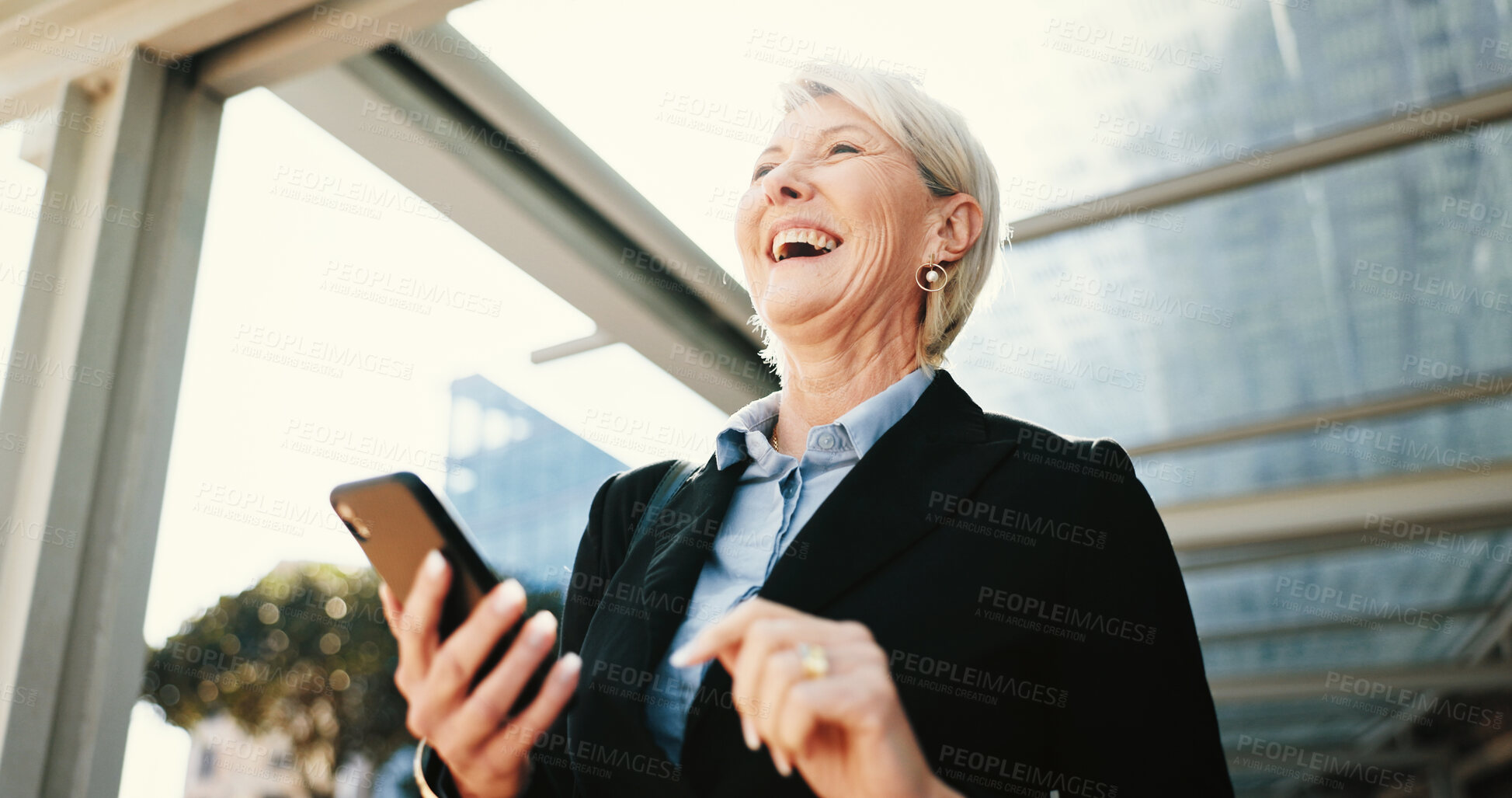 Buy stock photo Phone, laugh and businesswoman in city with communication for corporate travel with email. Happy, funny and low angle of mature CEO with online hotel checkin with cellphone for company trip in town.