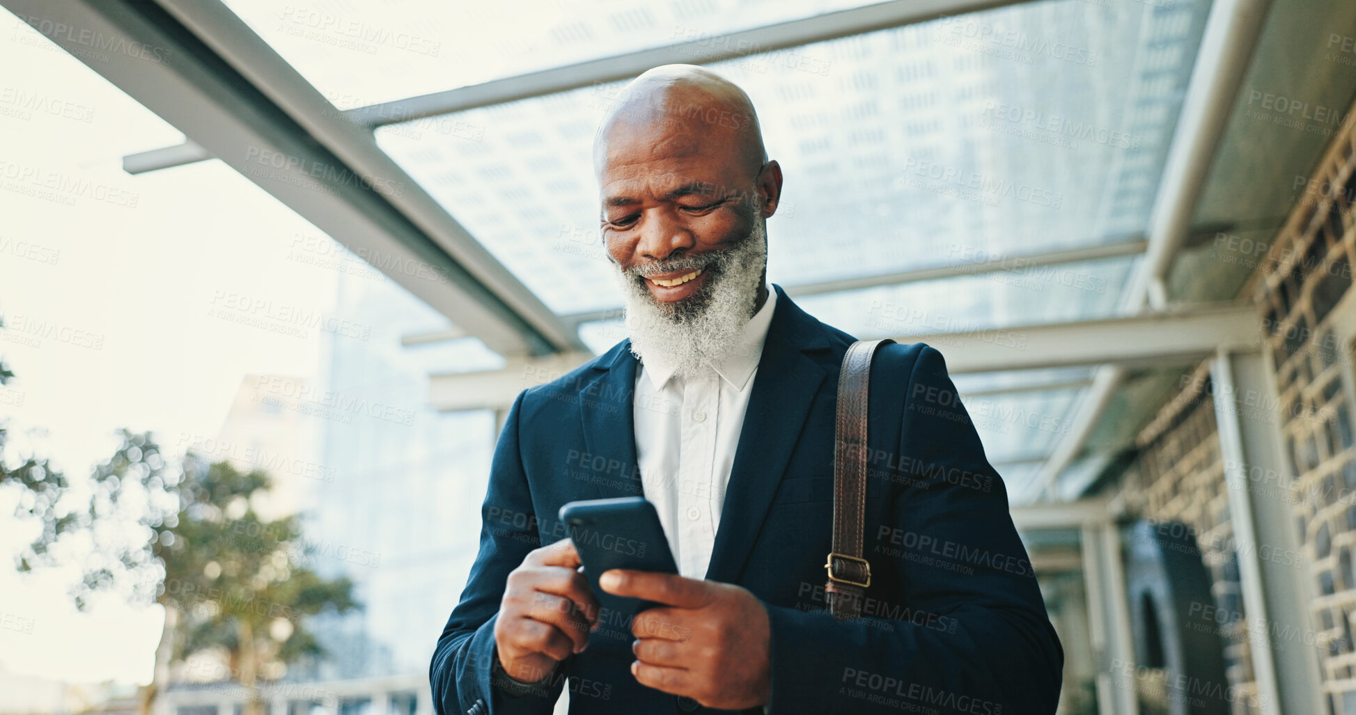 Buy stock photo Phone, walking and businessman in city with communication for corporate travel with email. Happy, commuting and African mature CEO with online hotel checkin with cellphone for company trip in town.