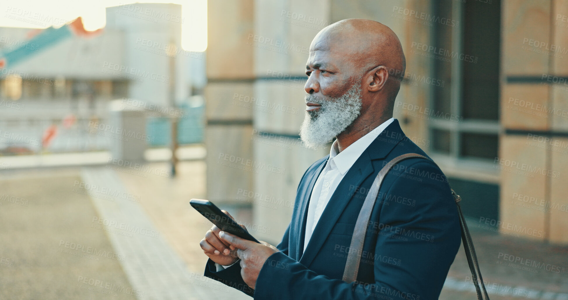 Buy stock photo Smartphone, travel and businessman in city with communication, social networking or connectivity online. Tech, phone and African male lawyer with email for legal case information on commute in town.