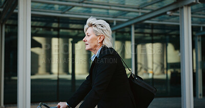 Buy stock photo Bicycle, outdoor and mature businesswoman in city with travel, journey or trip to office building. Commuting, cycle and professional female executive with eco friendly transport to work in urban town