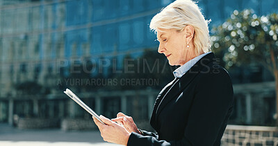 Buy stock photo Tablet, networking and mature businesswoman in city for email, connectivity or communication. Digital technology, research and female executive CEO with online contact for corporate deal in town.