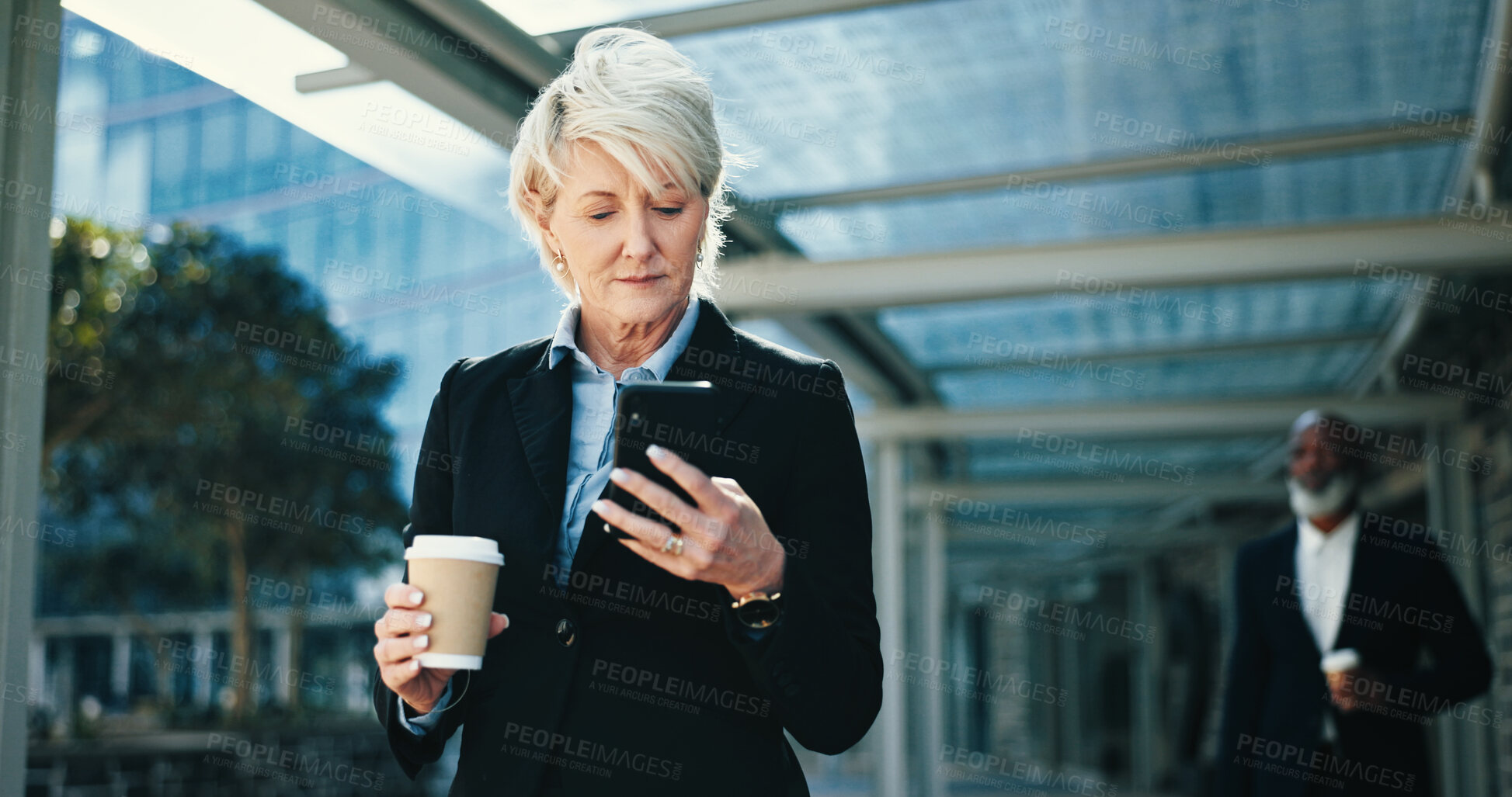Buy stock photo Phone, walking and businesswoman in city with communication for corporate travel with email. Network, commuting and mature female CEO with online hotel checkin with cellphone for company trip in town