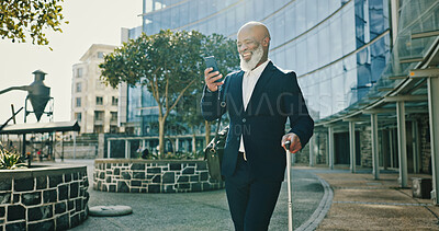 Buy stock photo Phone, happy businessman and travel with suitcase in city for journey, booking flight or planning trip schedule. Mobile, walking and mature African manager with luggage at building, hotel and commute