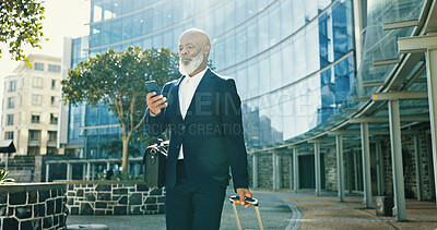 Buy stock photo Phone, business and black man with luggage in city for journey, travel schedule or booking flight. Suitcase, walking and mature professional with mobile at building, hotel or trip outdoor on commute