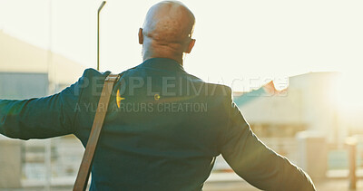 Buy stock photo Back, business man and celebration in city for success, investment profit and win lottery. African worker, cheers and victory outdoor, good news and dance for goal achievement or promotion at sunset