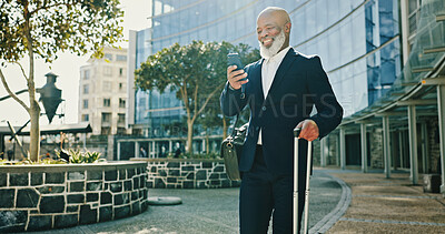 Buy stock photo Phone, businessman and travel with luggage in city for journey, booking flight or schedule. Mobile, trip and mature professional with suitcase at hotel, commute or happy African manager reading email